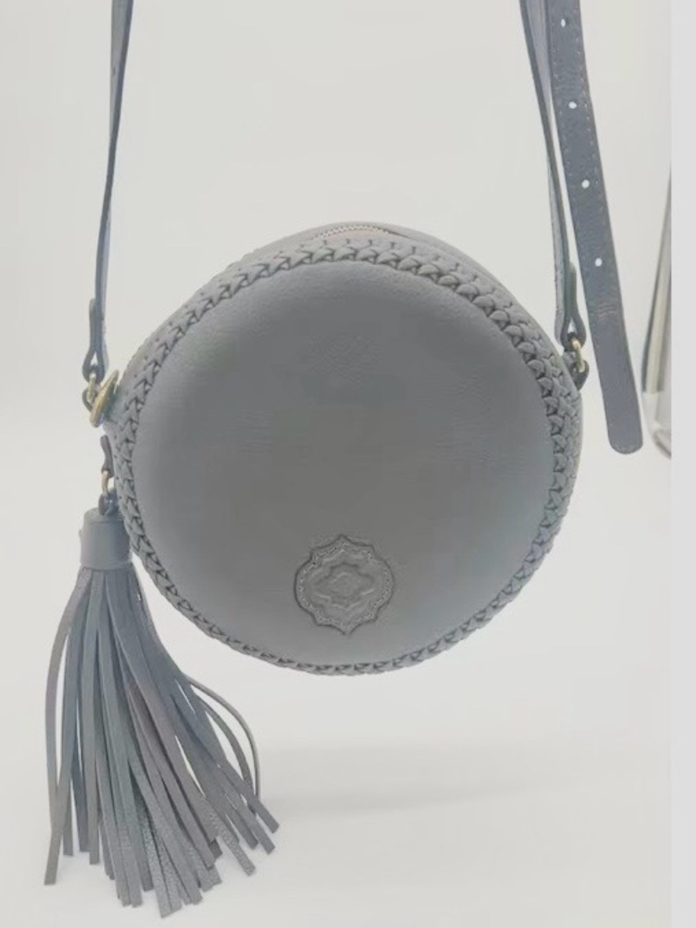 orYANY Kaye Round Canteen Pebbled Leather Crossbody Bag Grey Tassel